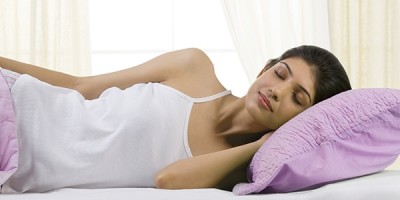A woman sleeping on a pillow