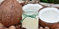 Coconuts with a jar of coconut milk