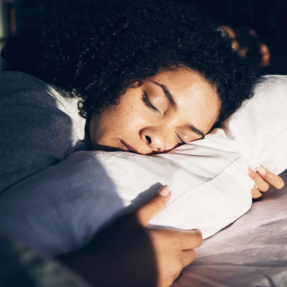 peaceful-woman-sleeping-on-white-bedding-indoors-2026-03-25-03-07-48-utc