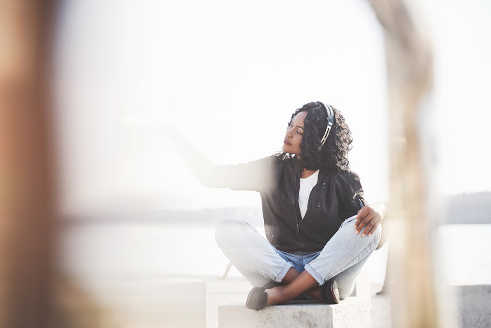 african-american-girl-sitting-on-the-beach-or-lake-2026-03-24-03-18-47-utc