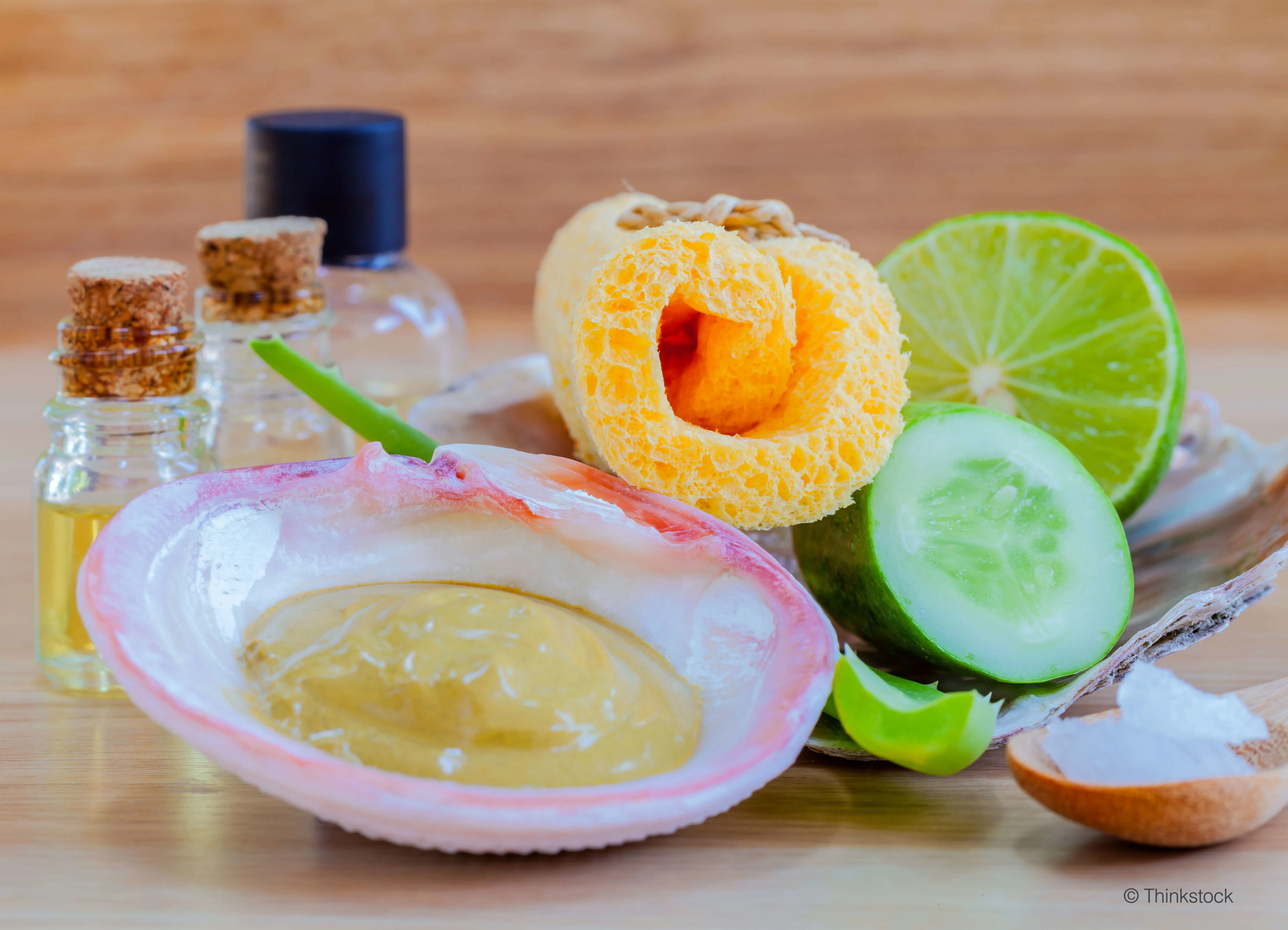 Homemade facial masks with natural ingredients on wooden table.