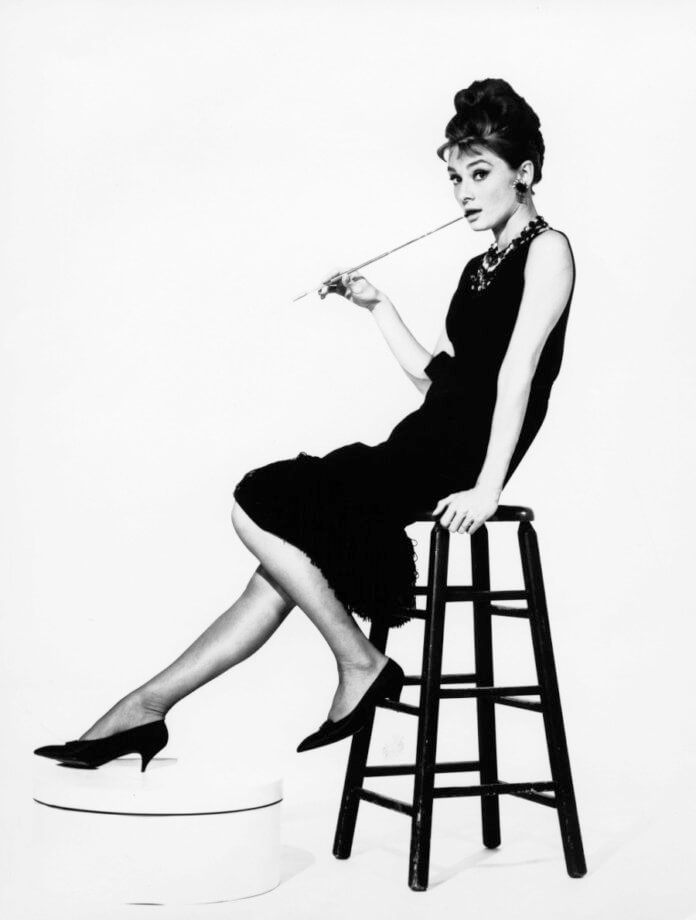 (GERMANY OUT) Audrey Hepburn, actress. Portrait on a bar stool. film still Breakfast at Tiffany?s - 1961  (Photo by Reinhard-Archiv / ullstein bild via Getty Images)