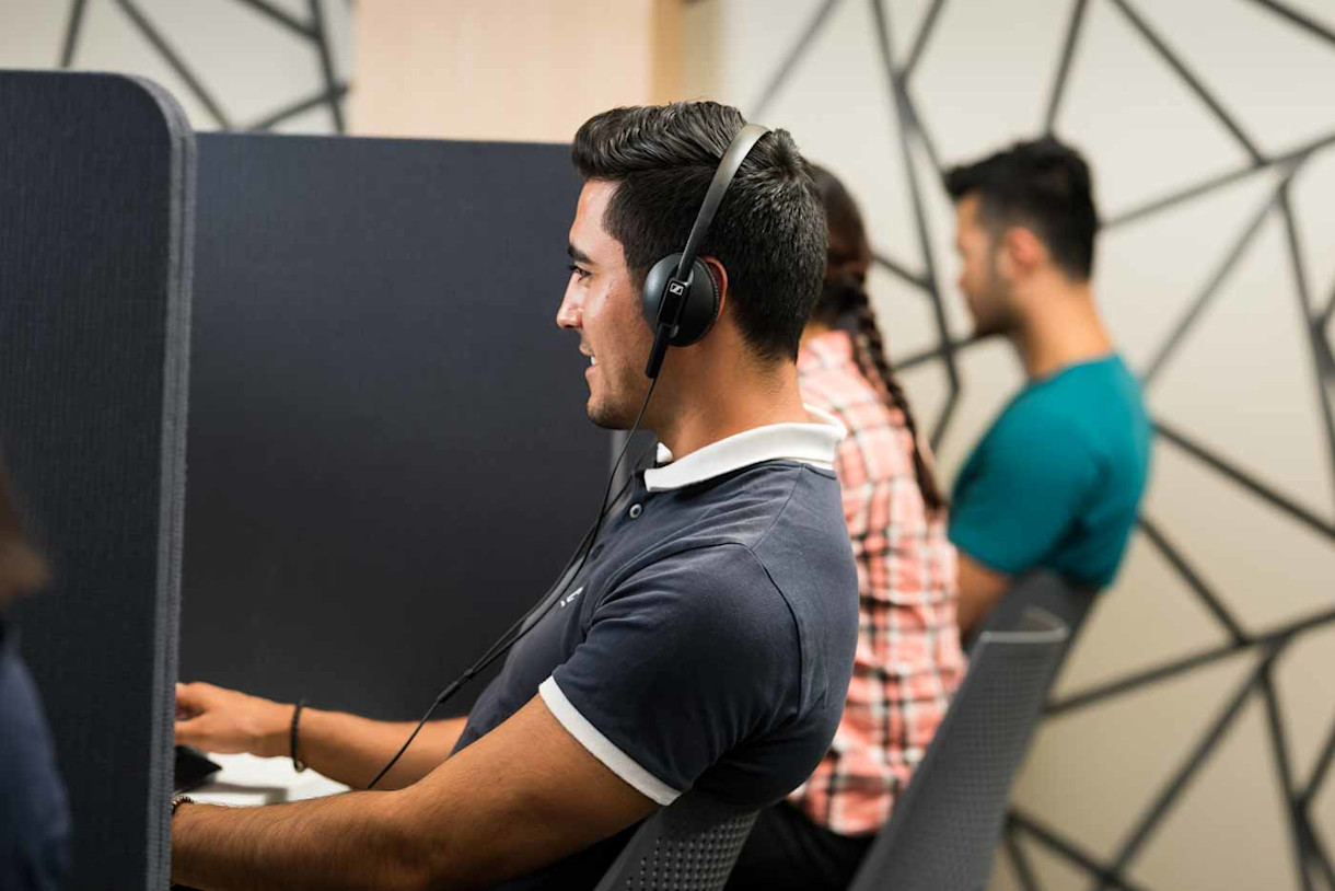 Image - Listening in an IELTS on computer test centre