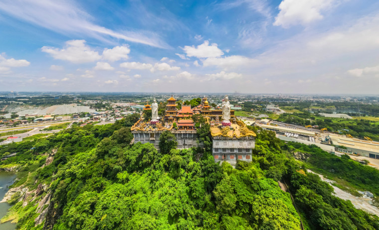 Aerial view of bodhisattva architecture and double sky dragon in Chau Thoi pagoda, Binh Duong province, Vietnam