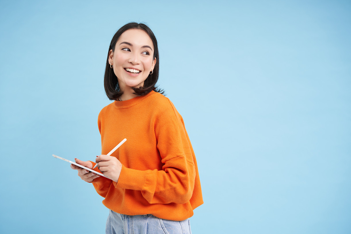 woman-teacher-holding-a-tablet-while-teaching