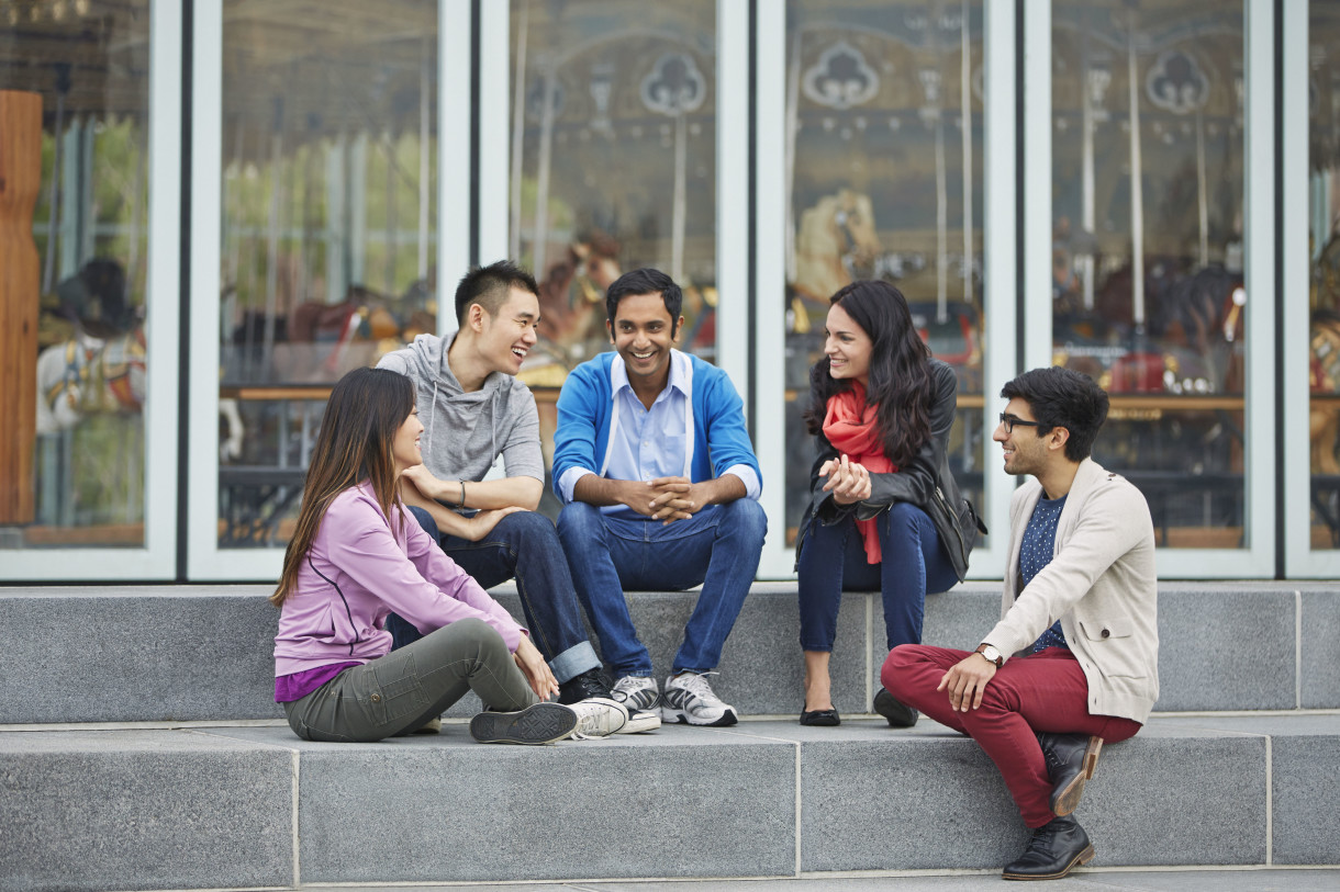 A group of students chatting in a park 