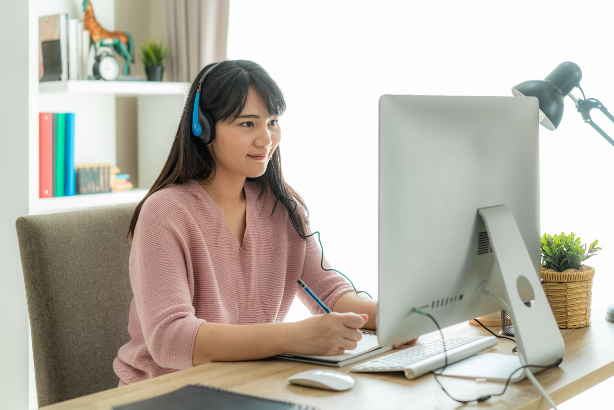 Test taker practicing for IELTS on computer