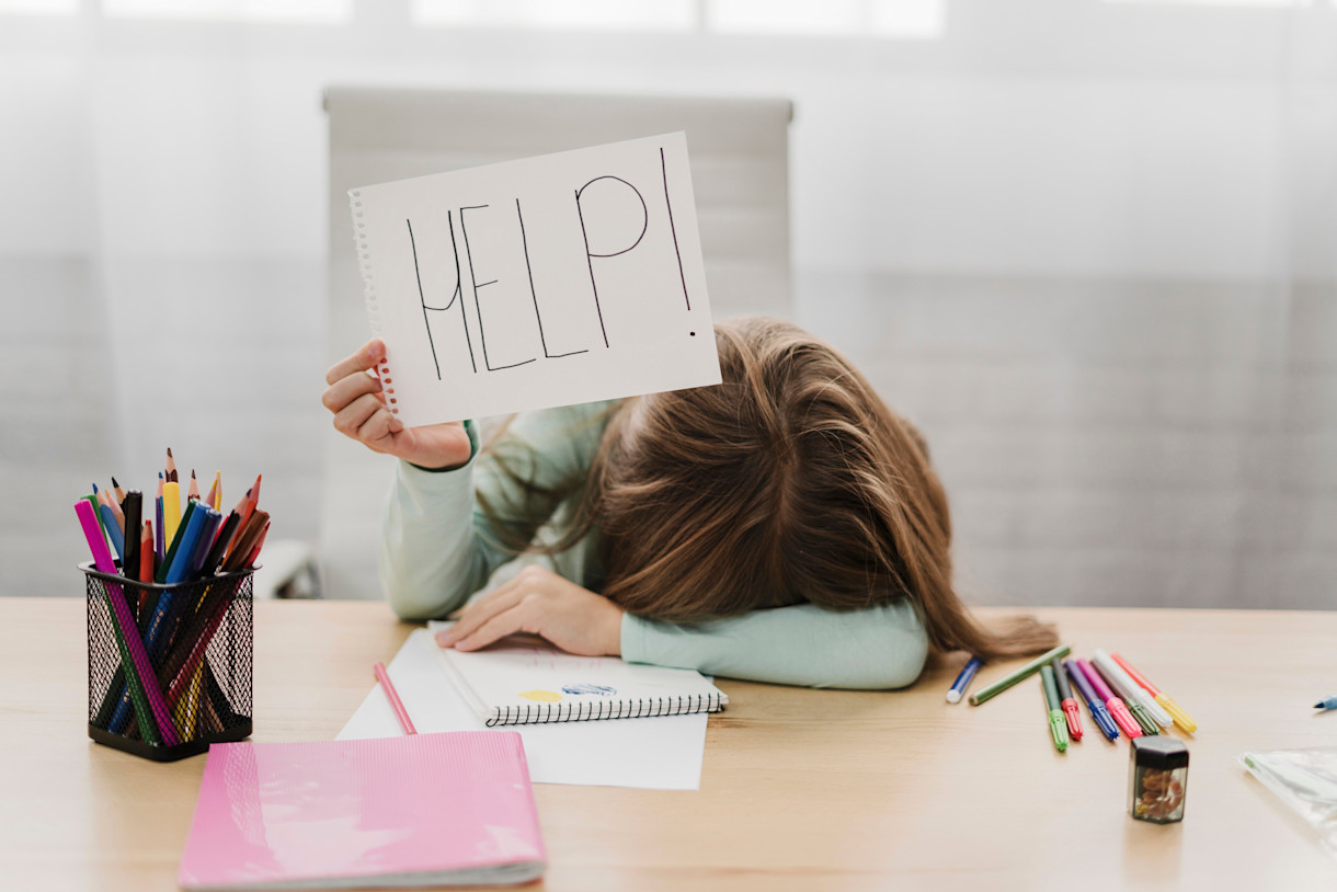 girl-holding-help-message-white-paper