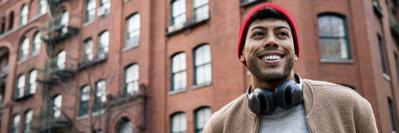 A man is outside an IELTS exam center, ready for the test