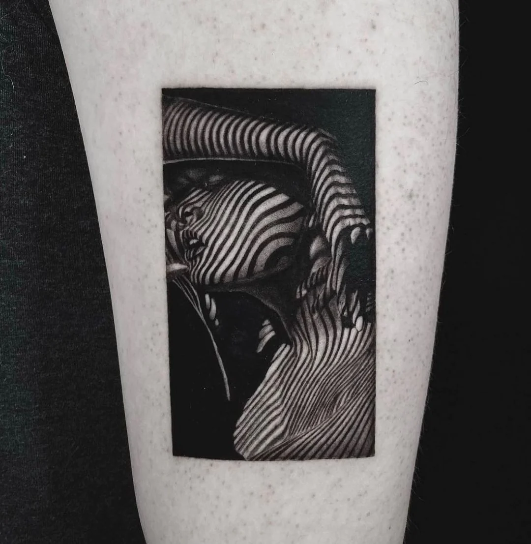 Intricate black & white tattoo by South City Market, London.