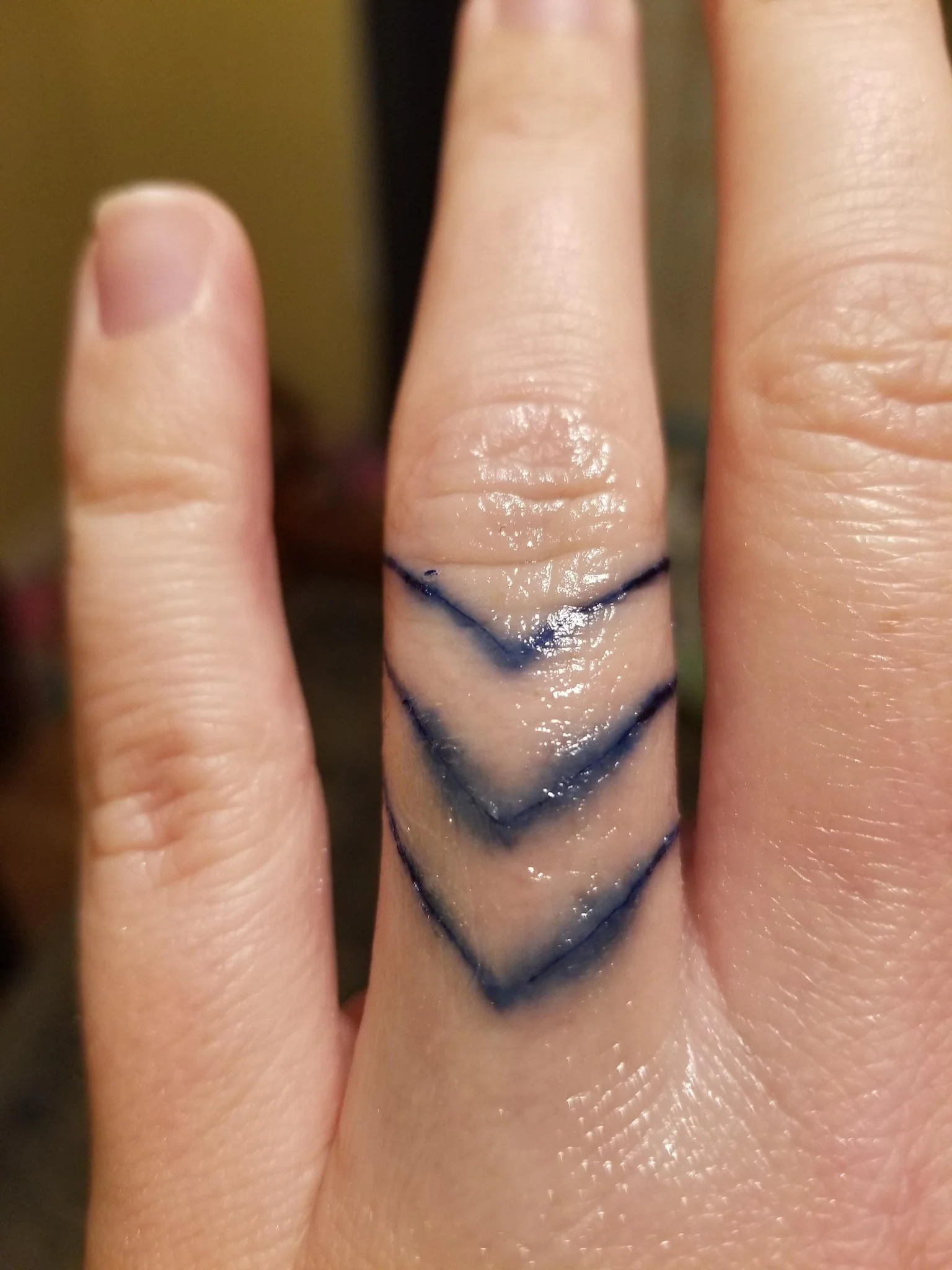 Blowout on a finger tattoo.