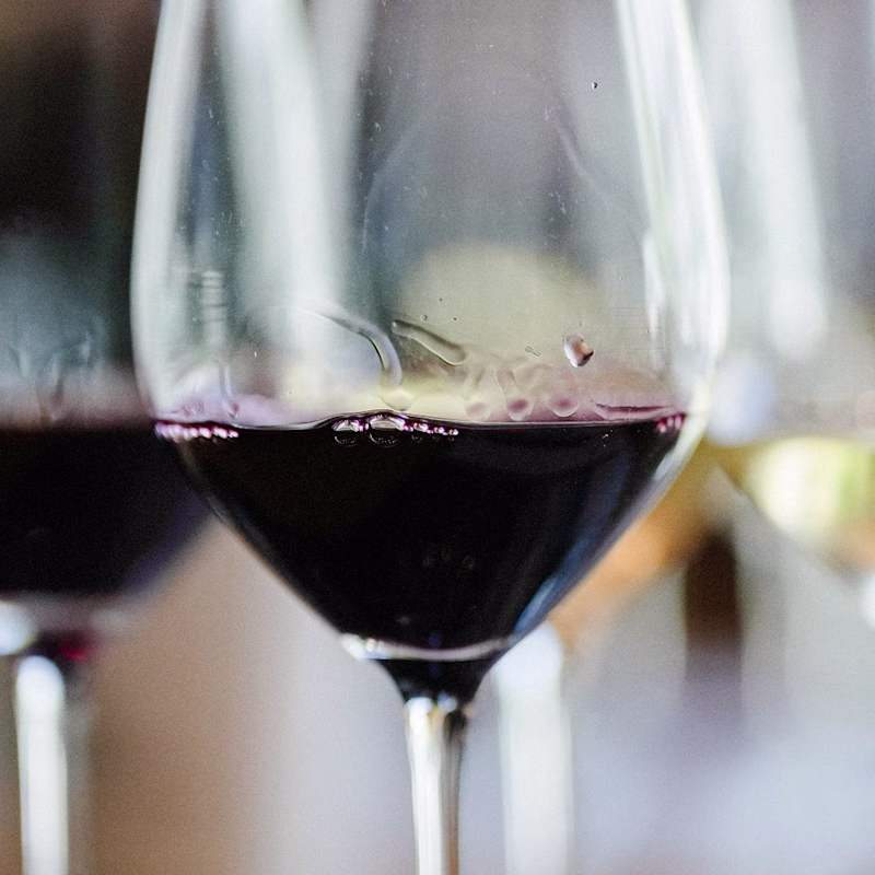 Close view of Ojai Mountain red wine poured into a tasting glass