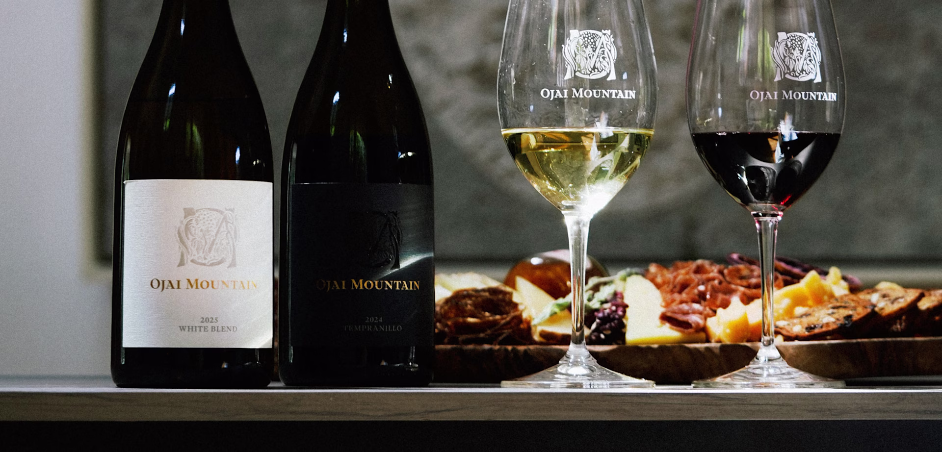Fall 2026 Release, White Blend and Tempranillo Ojai Mountain 2025 White Blend and 2024 Tempranillo bottles with poured glasses and charcuterie