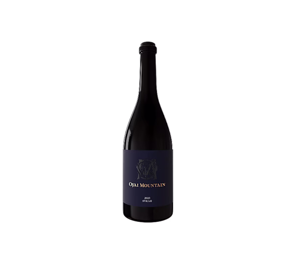 Ojai Mountain 2023 Syrah bottle with navy label on a plain light background