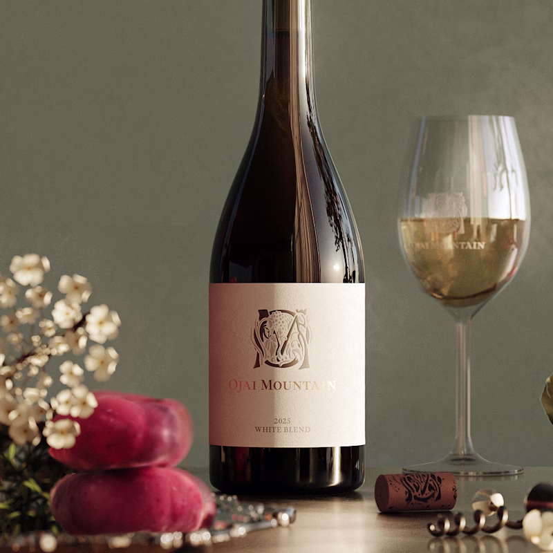 Ojai Mountain 2025 Estate White with Summer Plums Ojai Mountain 2025 White Blend with a poured glass, blossoms and peaches