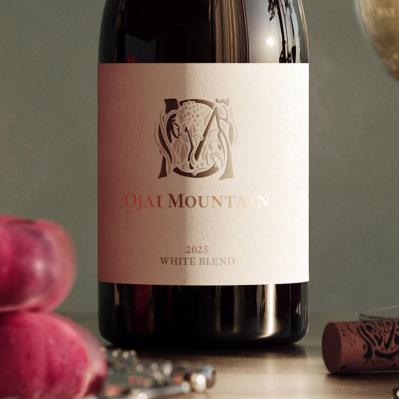 2025 Estate White Label Detail Close-up of the Ojai Mountain 2025 Estate White label with crest and plums
