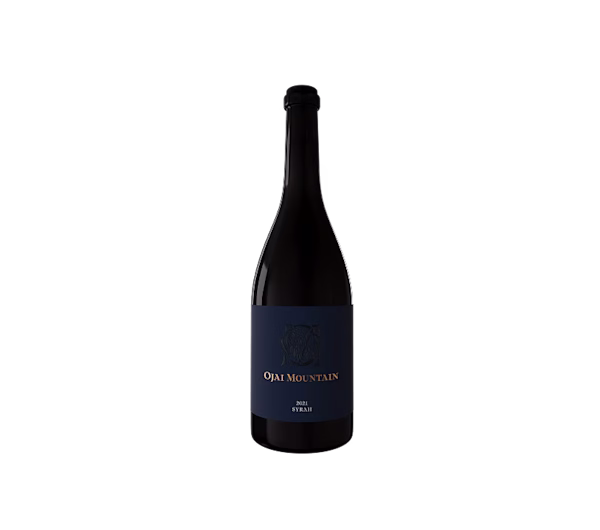 Ojai Mountain 2021 Syrah Bottle Ojai Mountain 2021 Syrah bottle with navy label on a plain light background