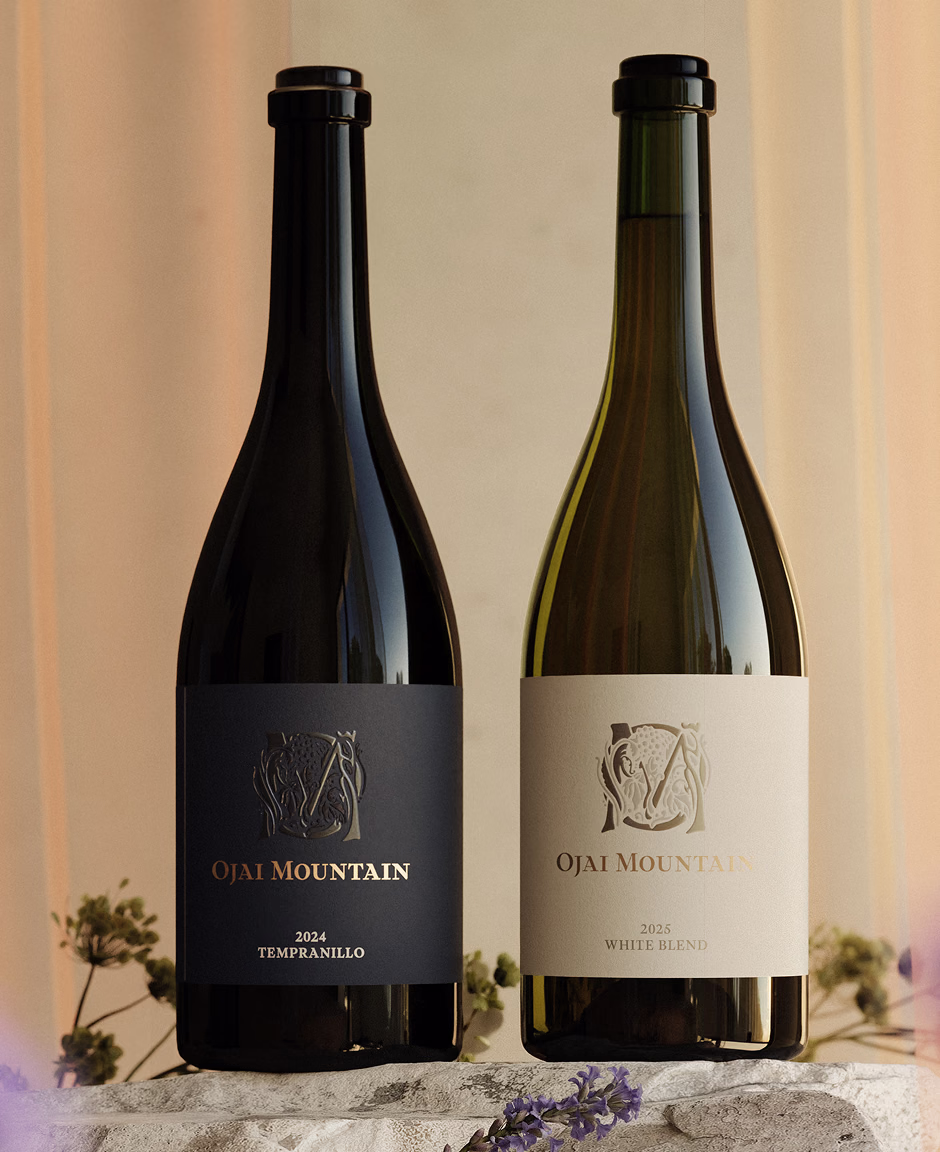 Fall 2026 Release: Tempranillo & White Blend Ojai Mountain 2024 Tempranillo and 2025 White Blend bottles on a stone ledge with dried flowers.