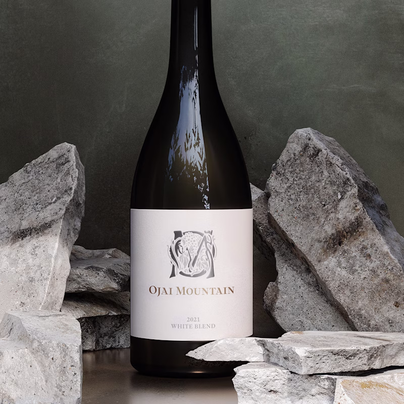 Ojai Mountain 2021 White Blend framed by large grey stone blocks Ojai Mountain 2021 White Blend framed by large grey stone blocks