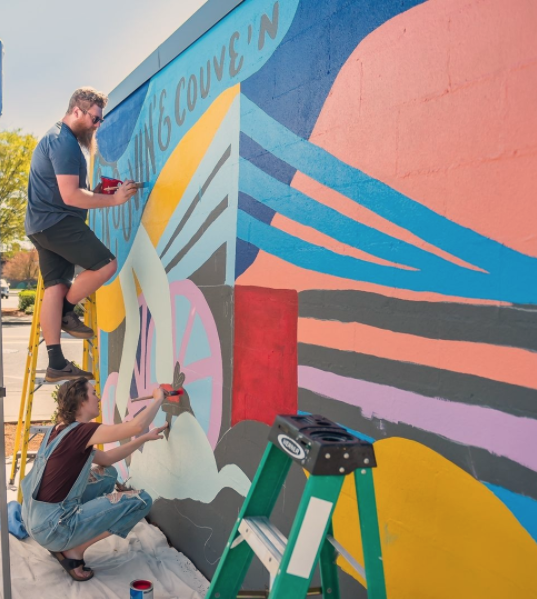 Artists from Riff_Creative painting the 'Groovin the Couve' mural in Vancouver, Washington. 