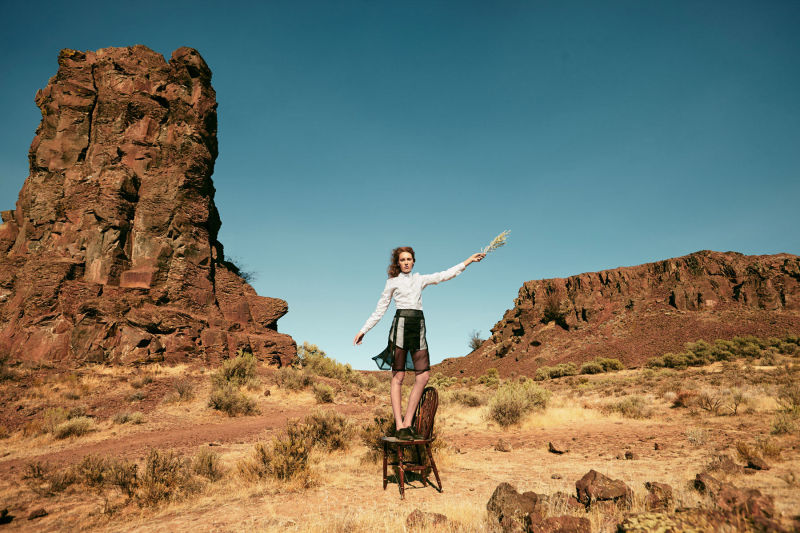 Woman on chair in the desert