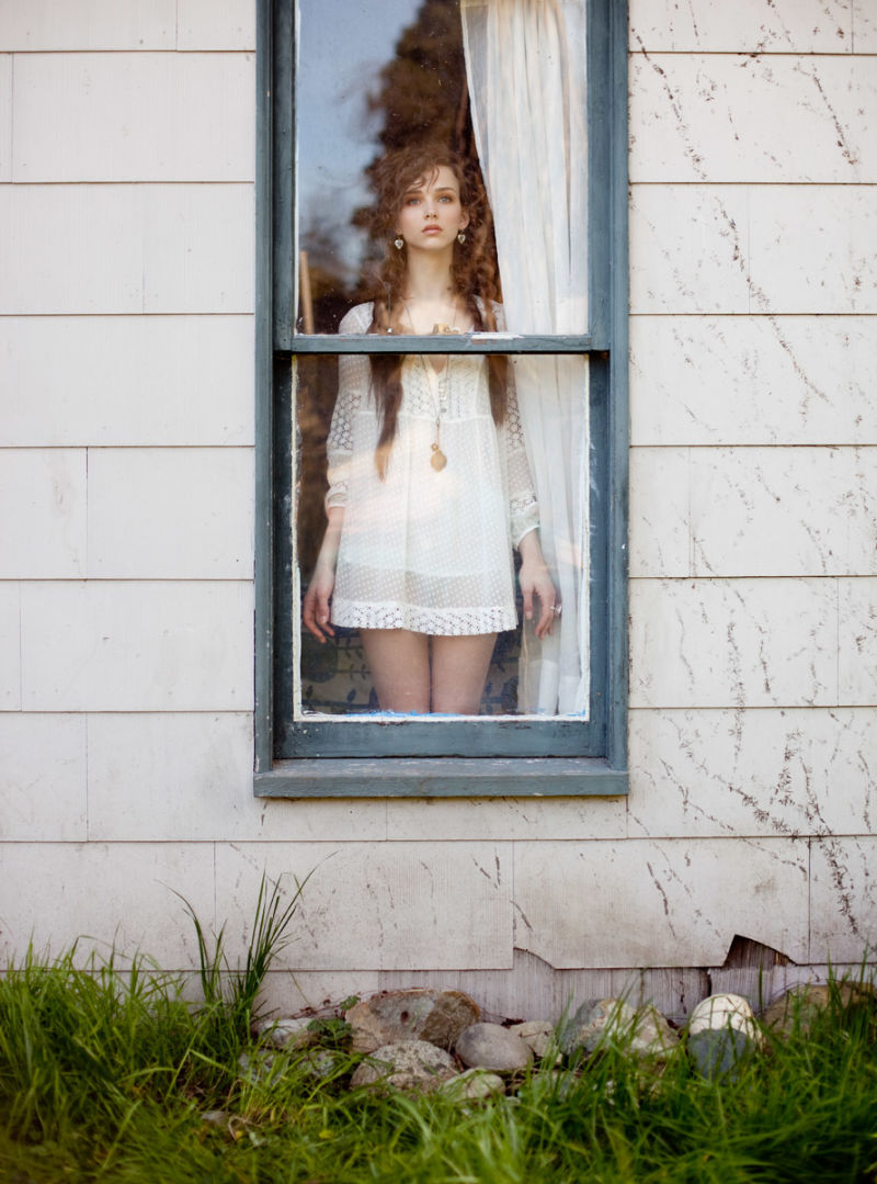 Woman looking out window