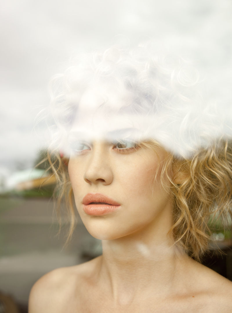 Woman looking out window