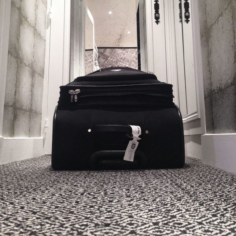 Suitcase on the floor at Relais Christine, Paris
