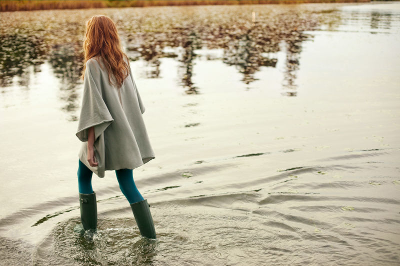 Woman walking through water