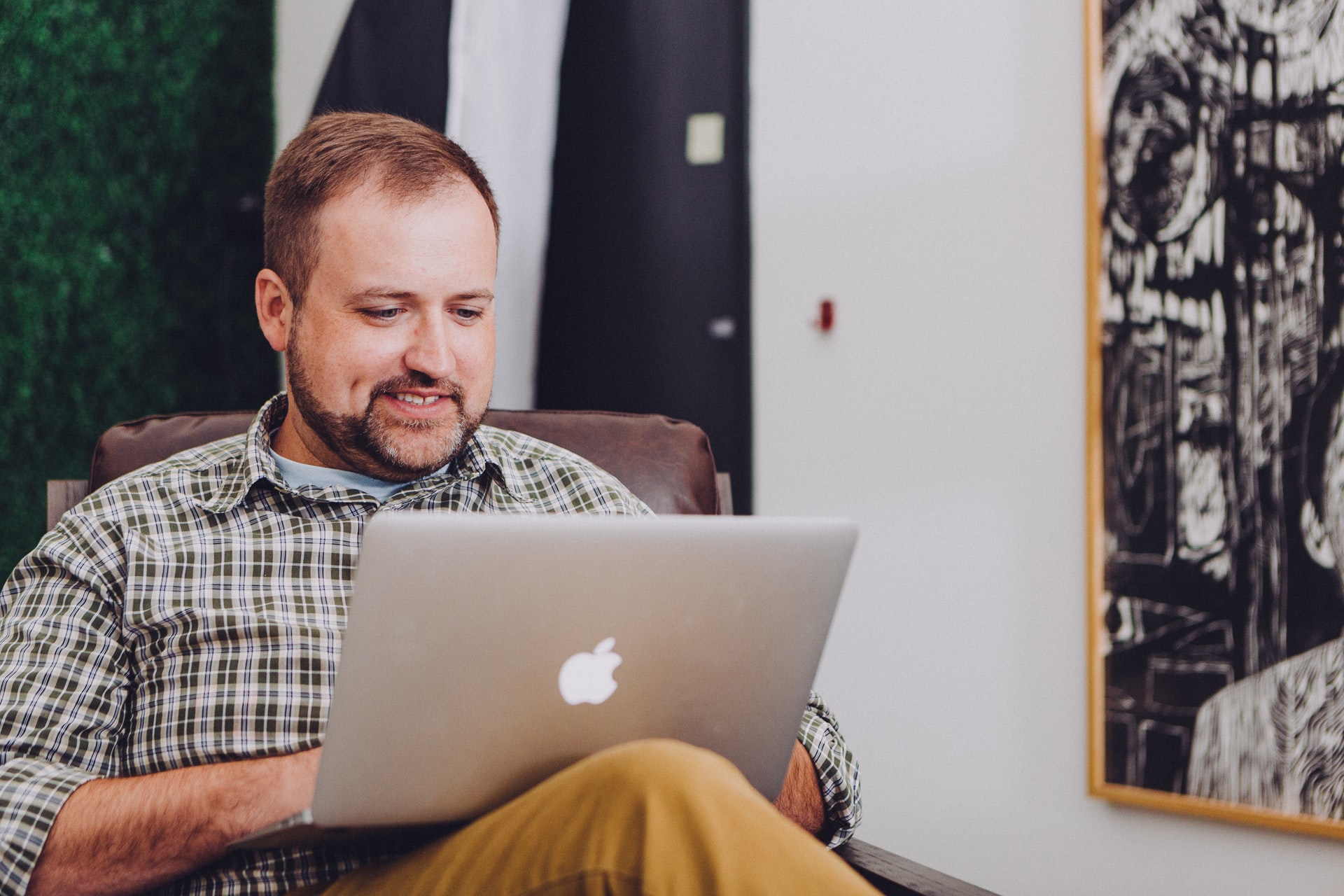 Man browsing the internet on his laptop.