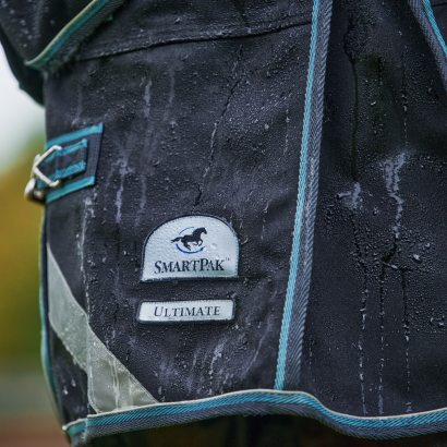 Rain drops running down off the SmartPak Ultimate WeatherShield Turnout Blanket.