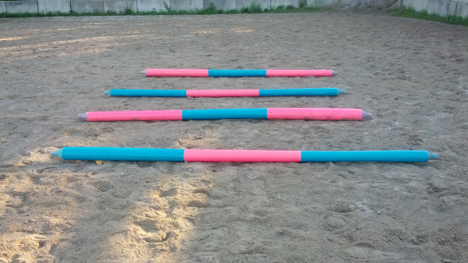 colorful pink and blue duct tape design ground poles for horseback riding