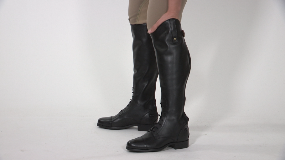 Example of tall boots that are too big where the rider can stick their whole hand down the top.