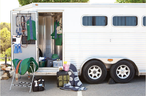 Horse trailer tack room with supplies ready to be packed.