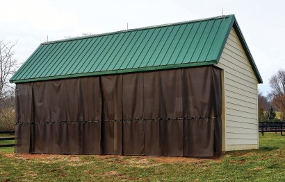 A shed barn with kool kurtains installed to keep bugs out.