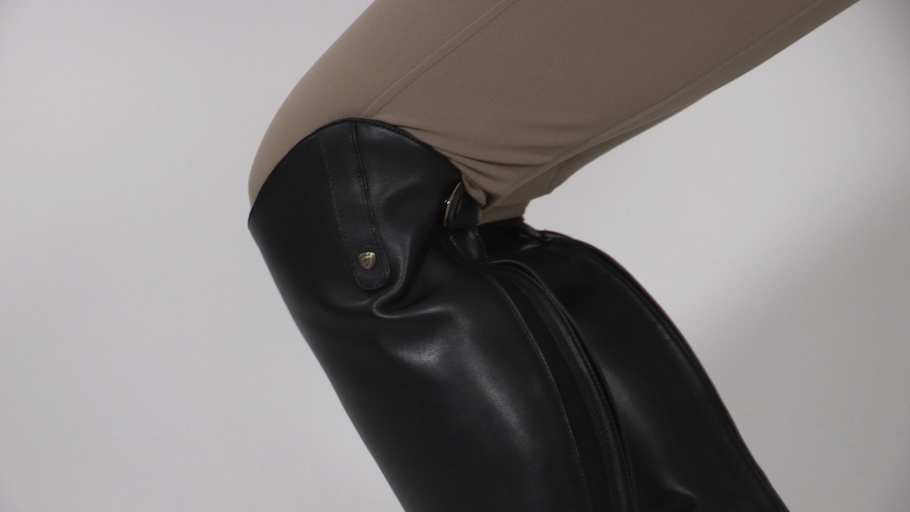 Example of tall boots that are too tall for the rider and wont fall enough for the proper fit.