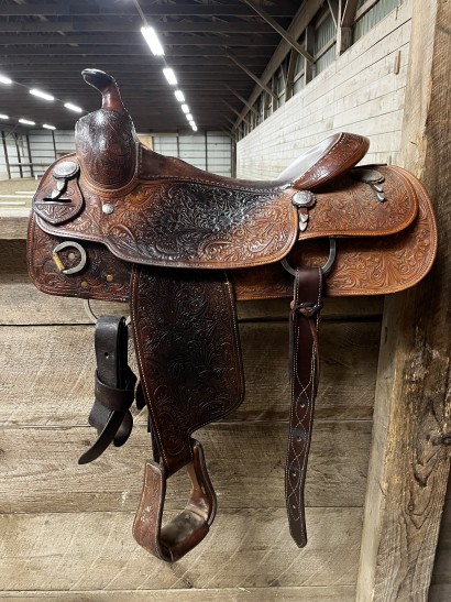 A clean medium oil western saddle facing to the left