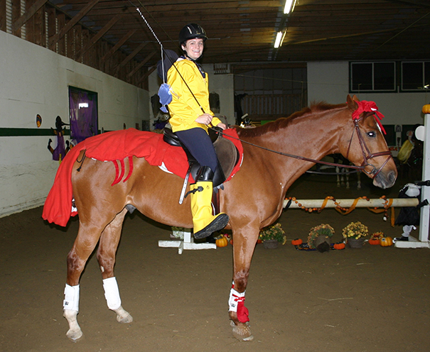 Black Horse with Glowing Eyes Holding a Pumpkin Spooky Halloween Theme