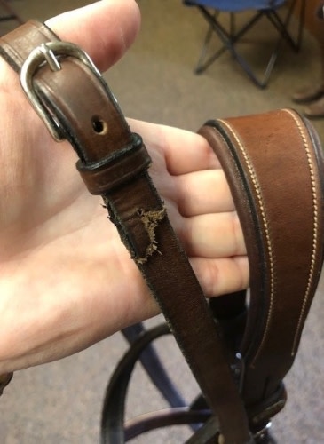 Broken end of reins on English bridle 