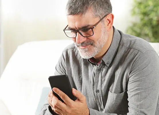  Man looking at smart phone 