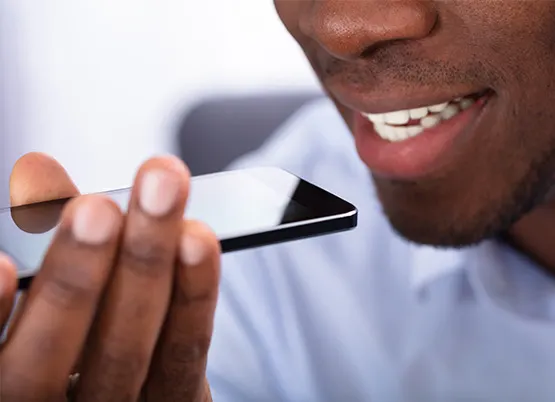  Man speaking to smartphone 