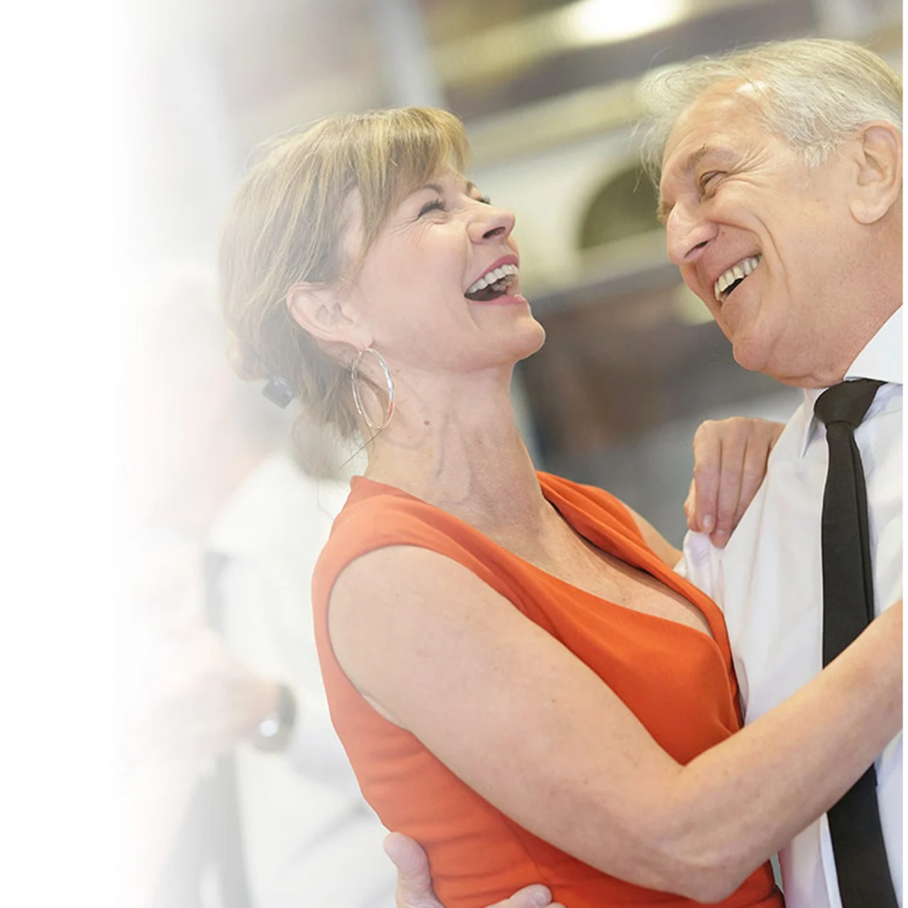 An elderly man and women dancing without feeling body