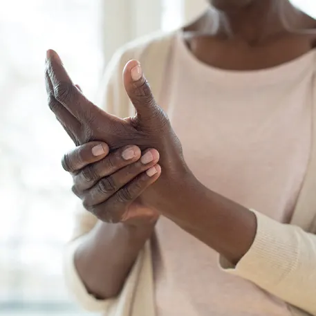 Woman massaging her hand