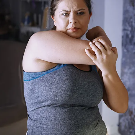  A woman stretching her arm before exercise