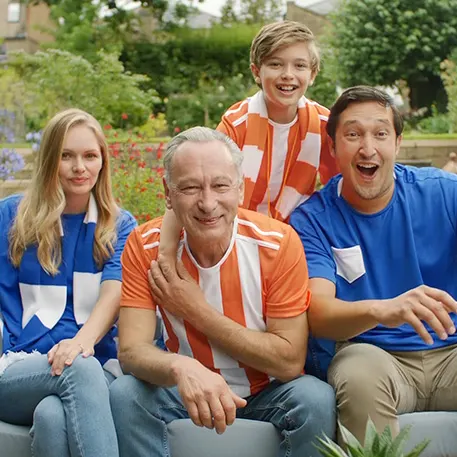 DerbFamily watching a football match