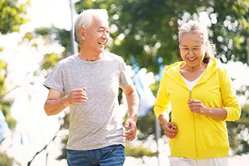  an older couple jogging outside