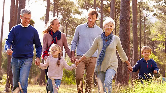 A family walking through forest