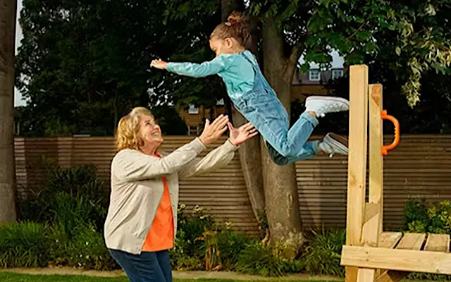 grandmother and grandchild playing in garden