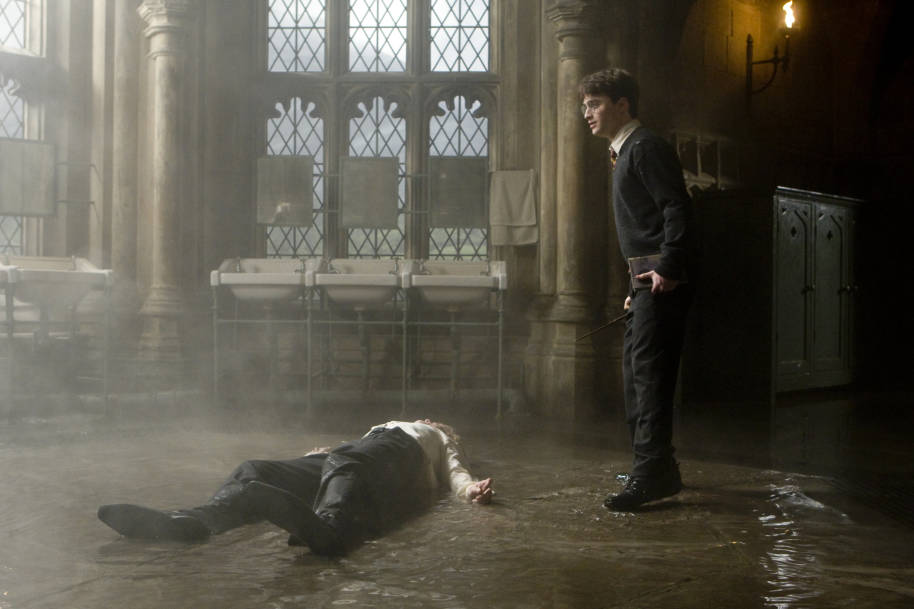 Draco lying on the bathroom floor after Harry's curse 