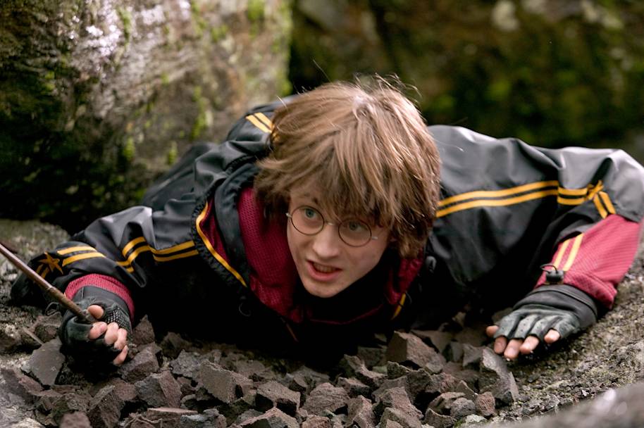 HP-F4-goblet-of-fire-harry-first-task-lying-down-avoiding-dragon-web-landscape